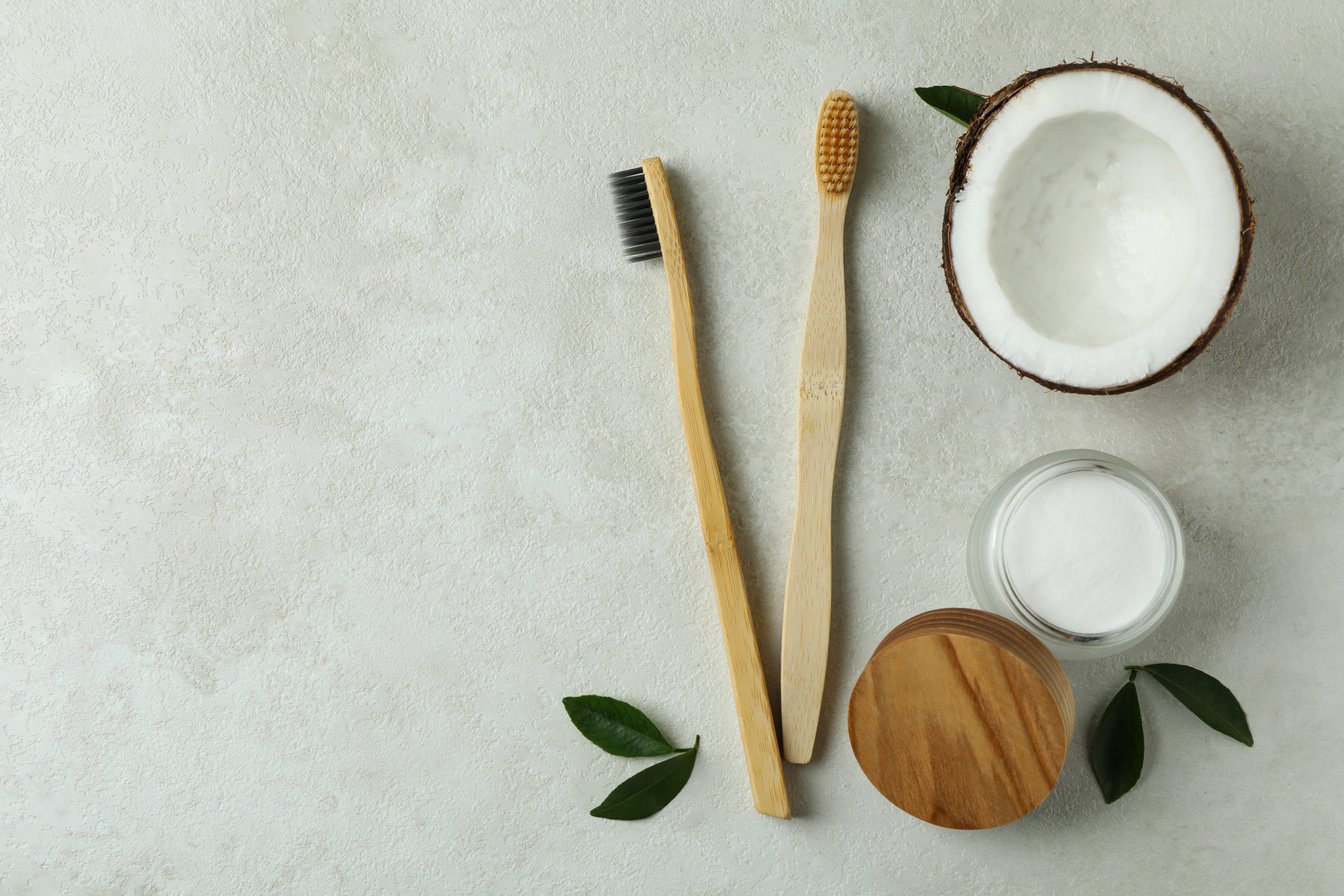 Oral Care Accessories on White Textured Background